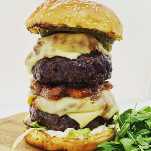 Peaky Blinders Manchester - Peaky Signature Burger ⁠ Ground brisket &  chunk steak patty, golden caramelised onions, black wax cheddar, shredded  lettuce and Peaky burger sauce. Perfectly paired with a cold pint